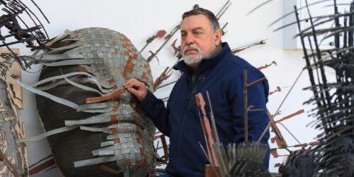 Anton Smit next to his sculpture